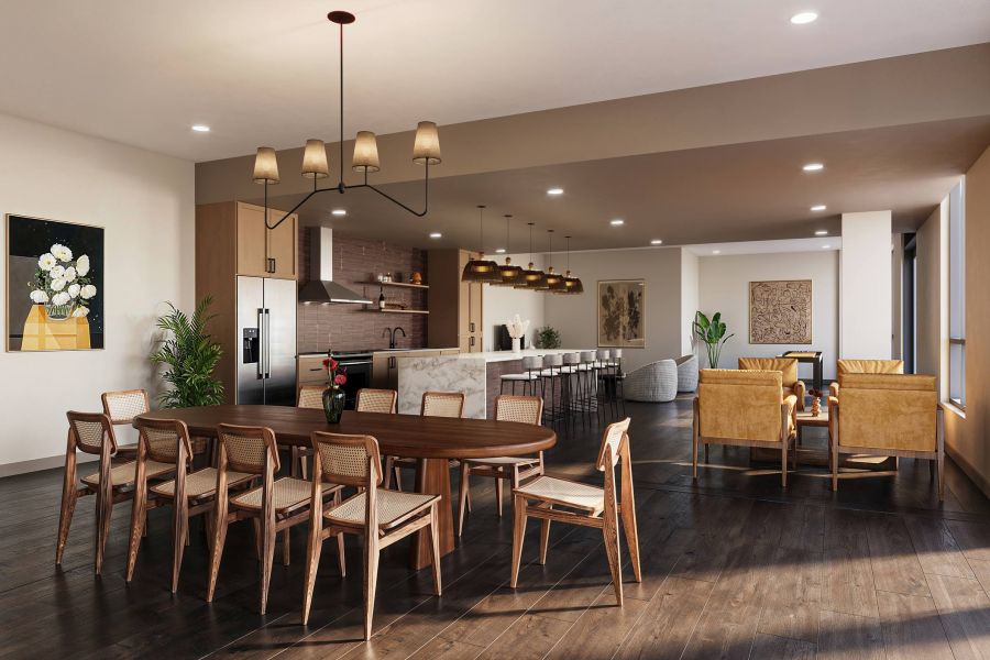 Modern open-concept dining and kitchen area with wooden furniture and warm lighting at Harlow.