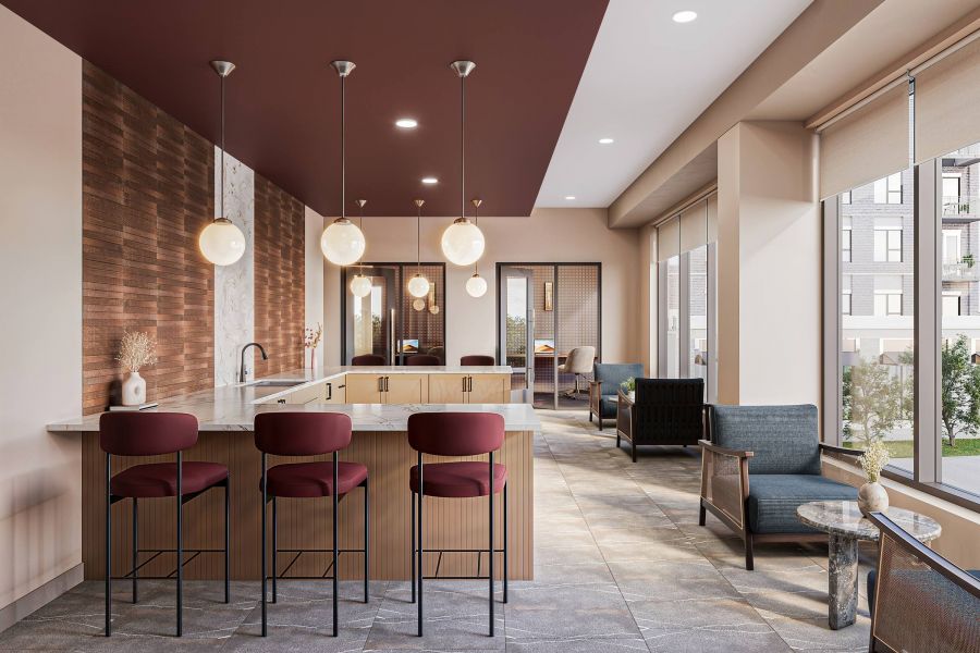 Modern kitchen lounge with marble island, three maroon bar stools, pendant lights, and large windows at Harlow.